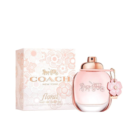Coach New York floral perfume bottle and packaging on a white background