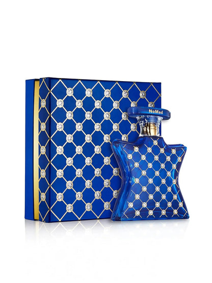 Blue patterned perfume bottle and packaging on a white background